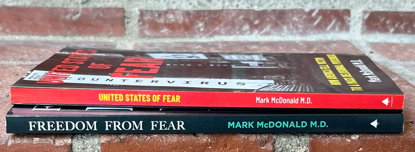 Spines of two books by Dr. Mark McDonald