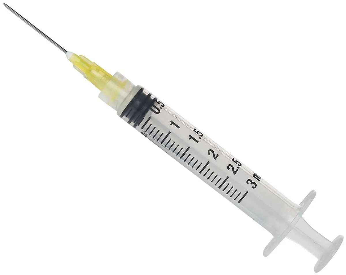 Syringe with needle at tip