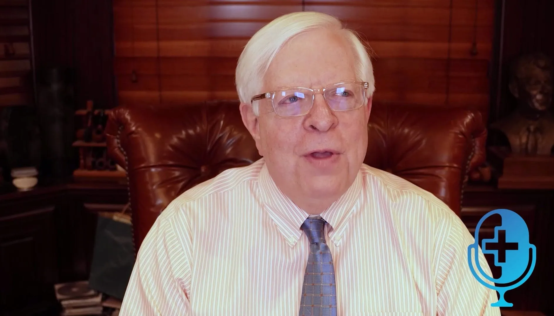 Dennis Prager seated behind his desk at home in Los Angeles