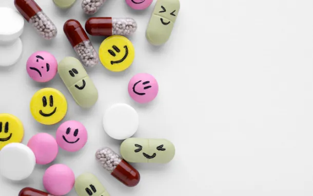 Brightly colored happy face pills