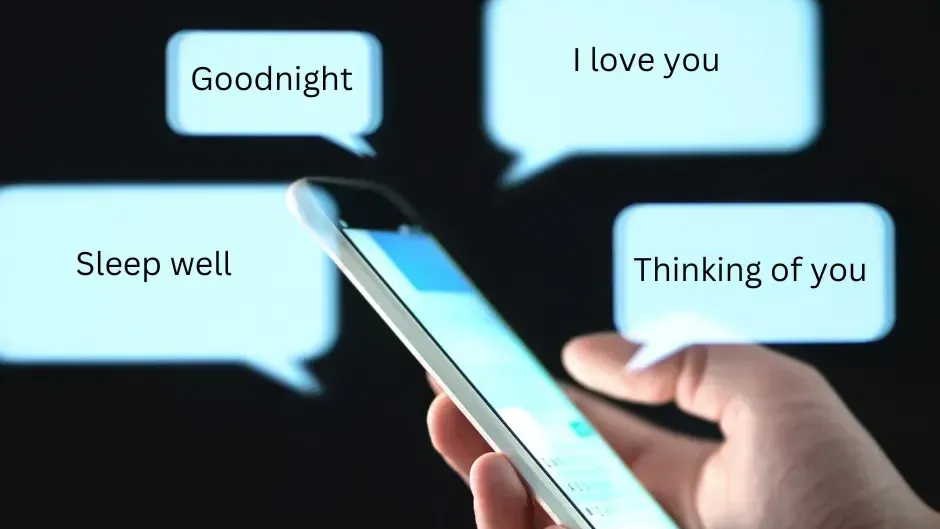 Hand holding cell phone displaying "Goodnight" text messages