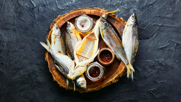 Fish in a basket, surrounded by jars of spices