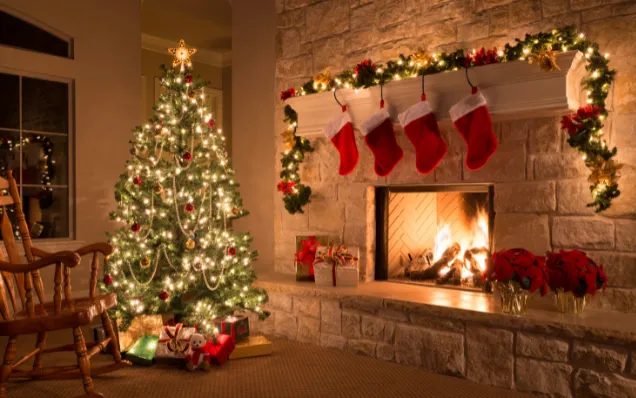 Home with fireplace and stockinged mantle, Christmas tree, and rocking chair