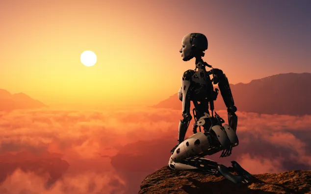 Female robot kneeling on mountaintop before setting sun