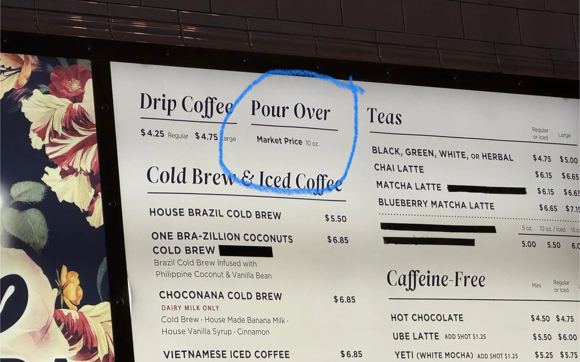 Coffee shop sign with "Market Price" pour over coffee
